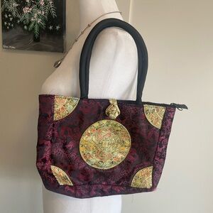 pink and gold Asian hand held bag